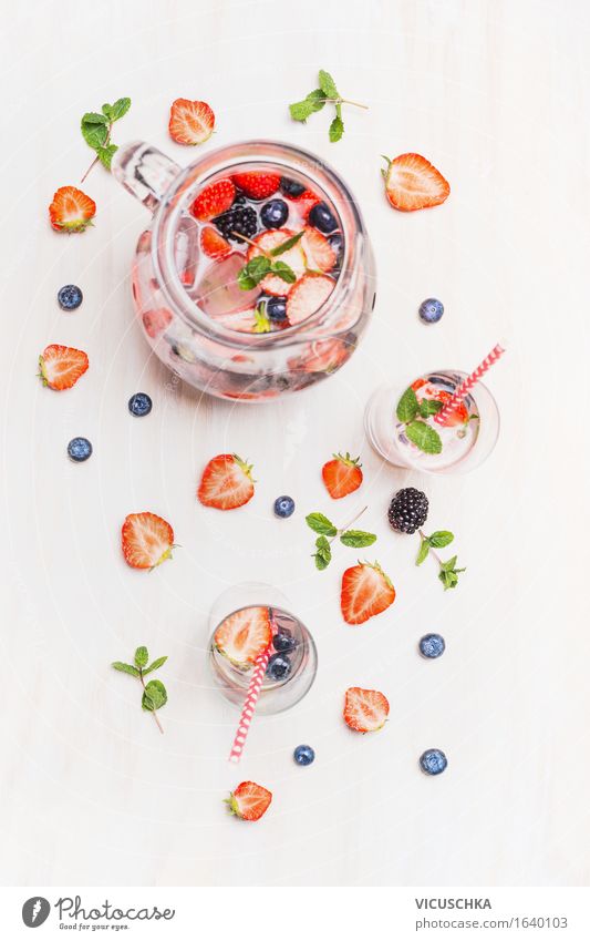 Summer drink with berries and ice cubes. Food Fruit Organic produce Vegetarian diet Diet Beverage Cold drink Lemonade Juice Longdrink Cocktail Glass Style