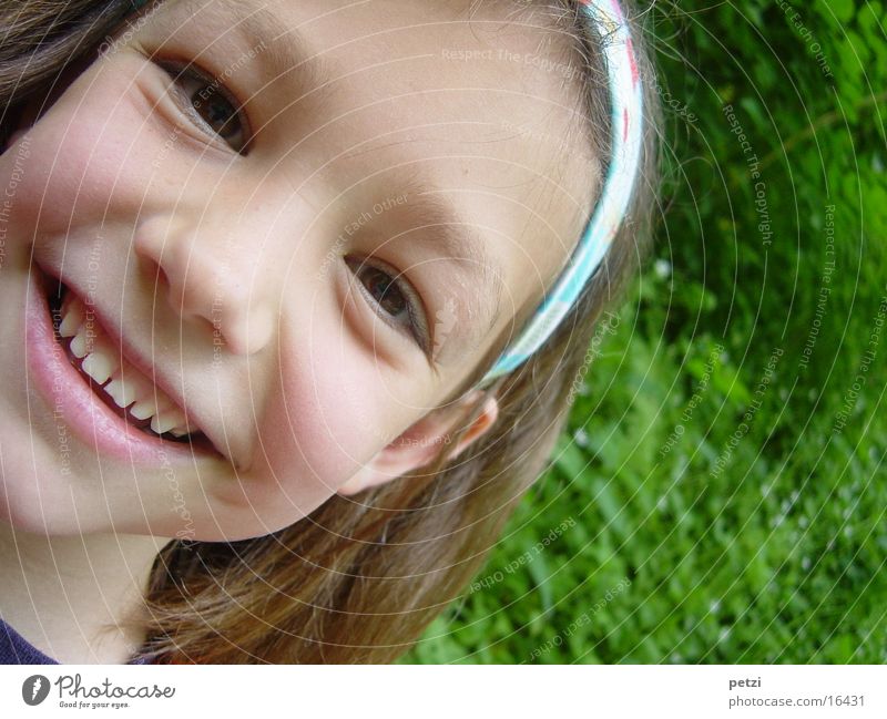 I'm so happy. Child Girl Meadow Laughter Happiness Green Colour photo Exterior shot Detail Copy Space right Central perspective Looking into the camera