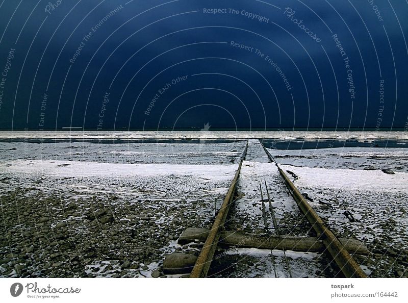 Rail into the lake Environment Nature Landscape Water Sky Night sky Winter Weather Ice Frost Snow Lakeside Arbon Switzerland Stone Railroad tracks Blue Esthetic