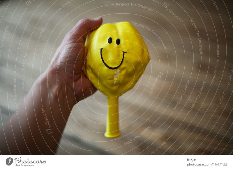 optimist Lifestyle Joy Hand Balloon Sign Smiley Smiling Friendliness Happiness Positive Yellow Emotions Moody Contentment Optimism Indicate Wrinkles Level
