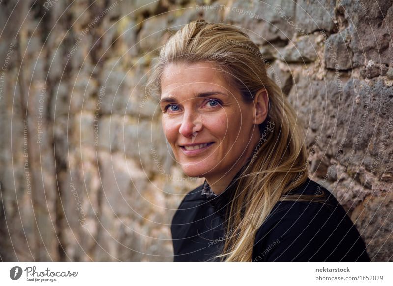 Middle Aged Woman Smiling Outdoors Portrait Lifestyle Happy Contentment Calm Human being Adults Blonde Stone Friendliness Natural Self-confident Action
