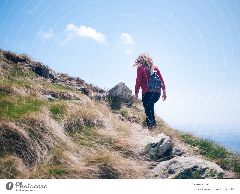 Woman walks on a mountain path in a sunny day. Wellness Life Well-being Summer Summer vacation Mountain Hiking Sports Adults 1 Human being Nature Landscape