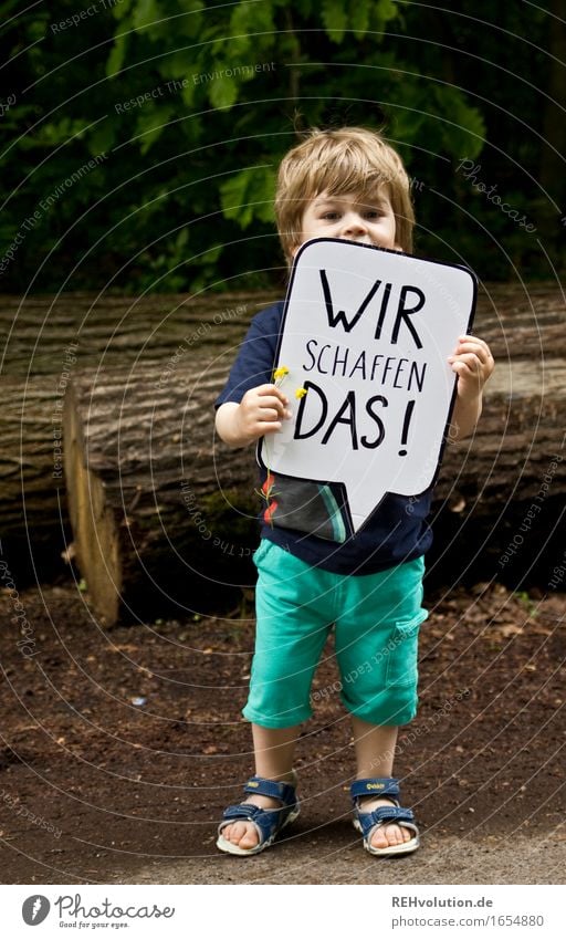 Child holds a speech bubble in the forest Human being Masculine Toddler Boy (child) 1 1 - 3 years Environment Nature Forest Characters Signs and labeling