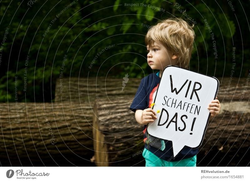 Toddler holding a speech bubble Human being Masculine Child Boy (child) 1 1 - 3 years Environment Nature tree Forest Bravery Determination Compassion Goodness