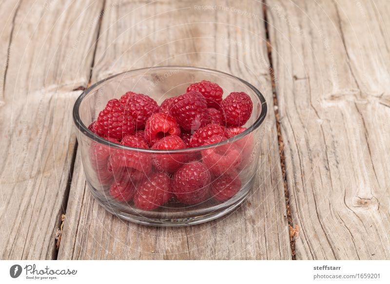 Clear glass bowl of ripe raspberries Food Fruit Nutrition Eating Breakfast Beautiful Body Healthy Plant Diet Pink Red Colour photo Multicoloured Interior shot