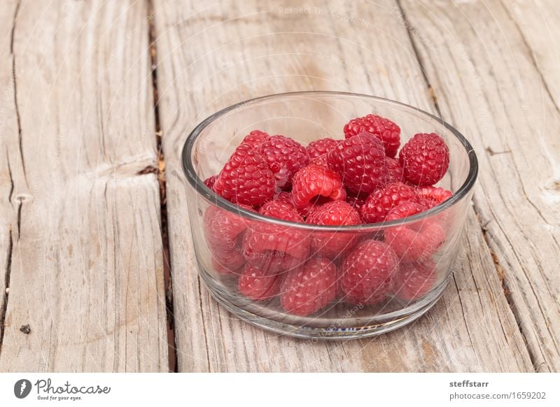 Clear glass bowl of ripe raspberries Food Fruit Nutrition Eating Breakfast Organic produce Vegetarian diet Diet Healthy Wellness Life Well-being Plant Pink Red