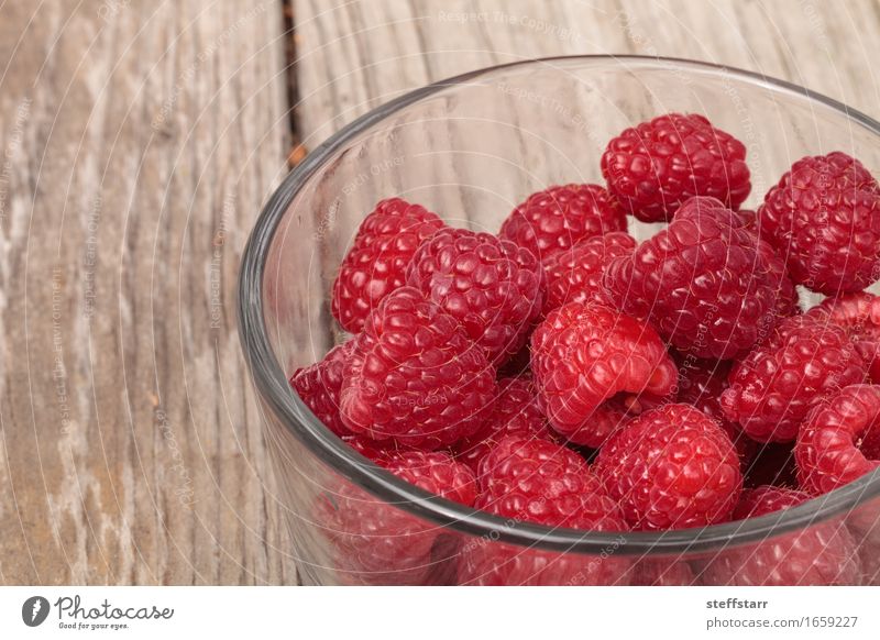 Clear glass bowl of ripe raspberries Food Fruit Nutrition Breakfast Picnic Vegetarian diet Bowl Glass Beautiful Skin Plant Diet Pink Red Colour photo