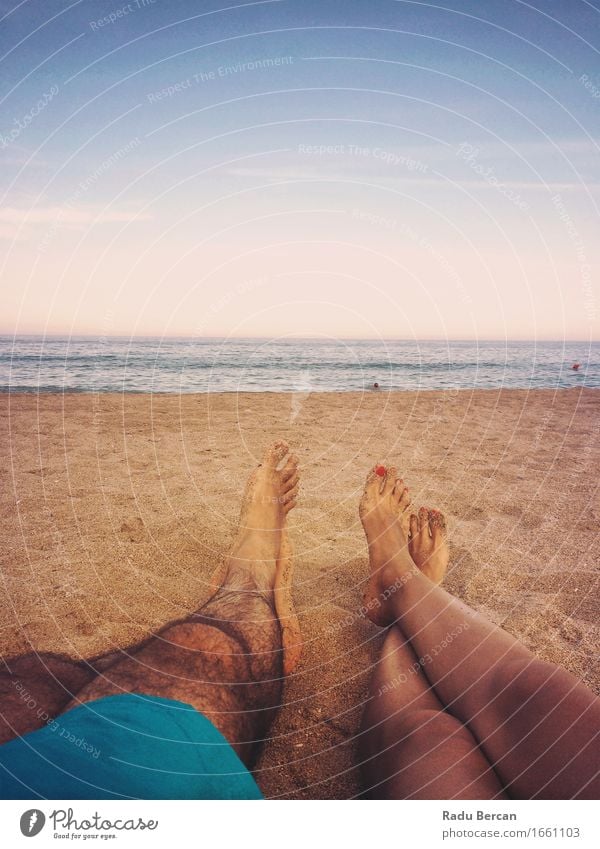 Loving Couple Relaxing On Ocean Beach At Sunset Well-being Relaxation Summer Summer vacation Sunbathing Human being Masculine Feminine Young woman