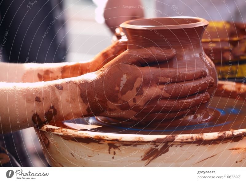 Potter making the pot in traditional style. Close up. Bowl Handicraft Work and employment Craft (trade) Human being 1 Art Culture Make Dirty Retro Brown