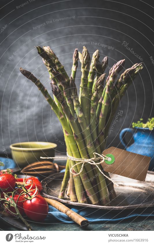 bundles of green asparagus on the kitchen table Food Vegetable Herbs and spices Nutrition Organic produce Diet Crockery Plate Bowl Pot Cutlery Spoon Lifestyle