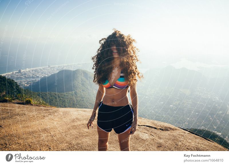 Happy woman with wildly tousled hair Lifestyle Joy luck Trip Summer Summer vacation Sun Mountain Hiking Feminine Young woman Youth (Young adults) 1 Human being