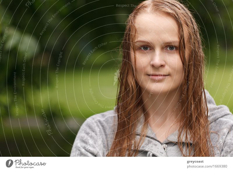 Portrait of a girl looking to the photographer in the park after rain with copyspace on left side. Lifestyle Happy Beautiful Face Summer Human being Girl
