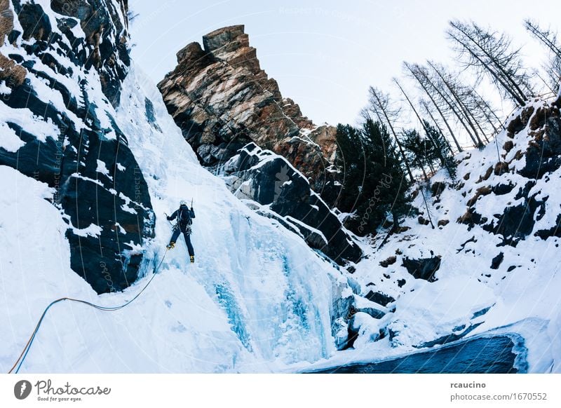 Ice climbing: male climber on a icefall Vacation & Travel Tourism Adventure Expedition Winter Snow Mountain Sports Climbing Mountaineering Human being Man