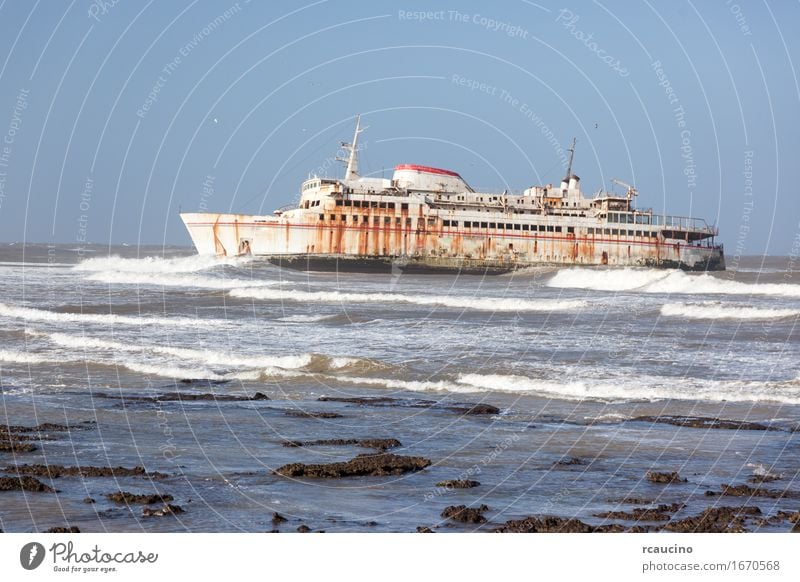 Ferryboat stranded on the shore in Tarfaya, Morocco Beach Ocean Waves Coast Transport Watercraft Metal Rust Old Shipwreck abandoned Wreck Stranded vessel