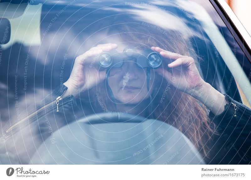 Observations, with binoculars out of a car Human being Feminine 1 Means of transport Motoring Car Red-haired Binoculars Observe "Detective spy peer spy out