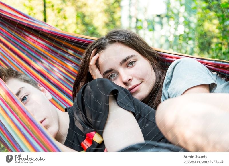 Two teen siblings chilling in a hammock Lifestyle Well-being Contentment Relaxation Vacation & Travel Tourism Summer Human being Feminine Young woman