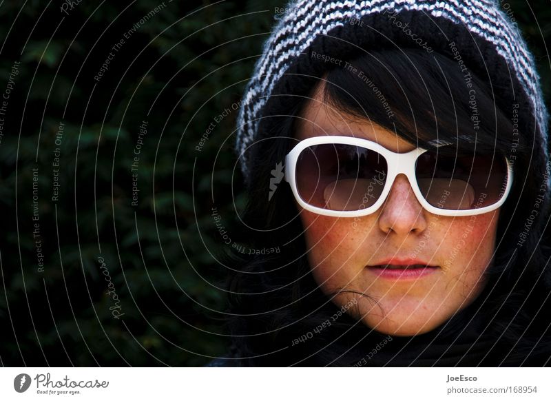 sunglasses and bobble hat Colour photo Exterior shot Copy Space left Day Portrait photograph Looking Looking into the camera Feminine Woman Adults Head