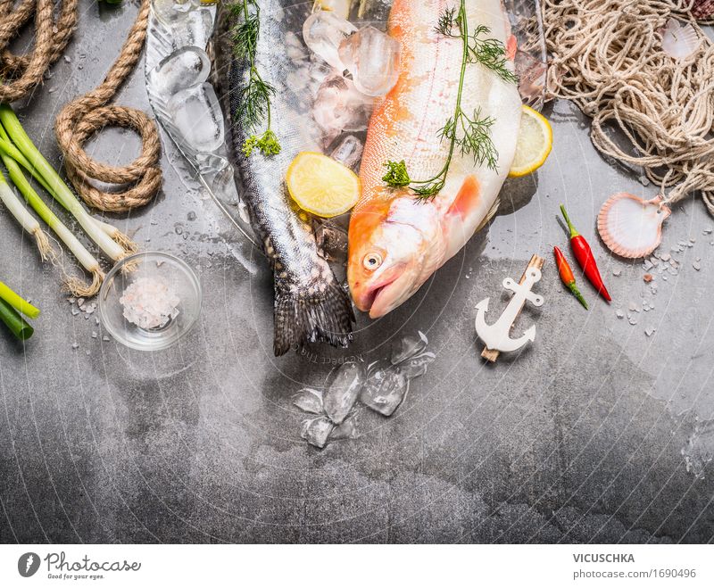 Fresh raw whole trout with ingredients Food Fish Herbs and spices Nutrition Banquet Organic produce Vegetarian diet Diet Bowl Style Design Healthy Eating Raw