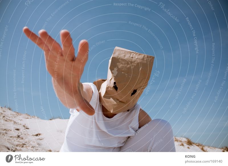 abra abra cadabra Colour photo Looking into the camera Human being Masculine Hand 1 Summer Desert Underwear Mask Sack Paper bag Select Touch Aggression Hideous