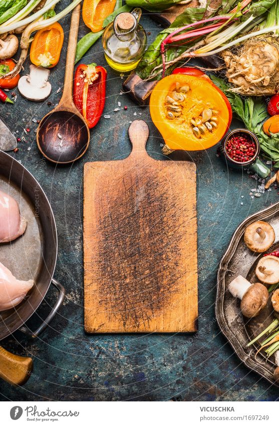 Cutting board with pumpkin and ingredients Food Vegetable Herbs and spices Cooking oil Nutrition Dinner Banquet Organic produce Crockery Pot Spoon Style Design