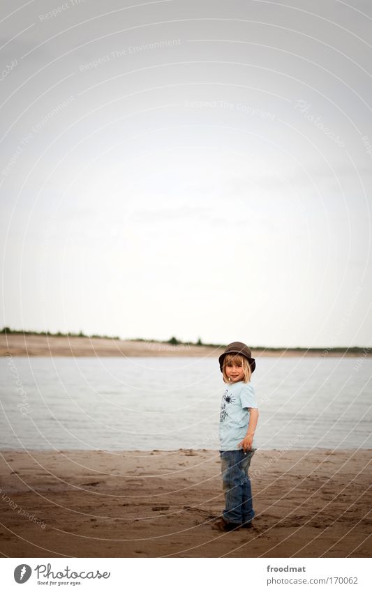little man at the little sea Colour photo Subdued colour Exterior shot Copy Space top Day Wide angle Full-length Looking into the camera Human being Masculine