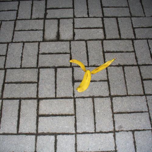 the way and the banana peel Colour photo Flash photo Banana Lanes & trails Stone Lie Throw Orderliness Cleanliness Dangerous Fear Environment Accident Slip