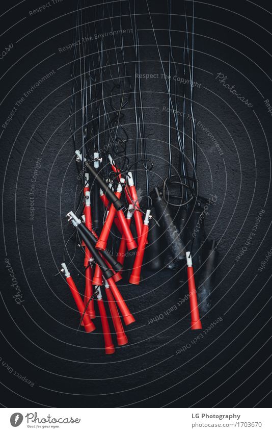 Detail shot of jump ropes at a gym. Body Wellness Sports Fitness Jump Speed Strong Red Black Power bar bell crossfit equipment Practice Gymnasium handles