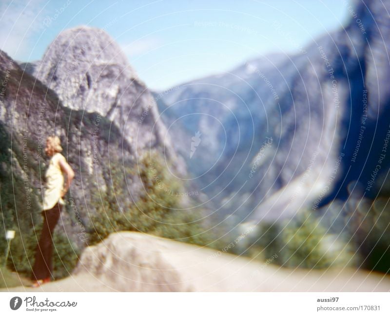point of return Black & white photo Exterior shot Blur Long shot Looking away Woman Adults 1 Human being Landscape Rock Alps Mountain Boredom Vantage point Trip