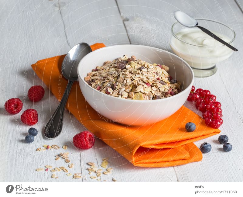Muesli with yoghurt and fruits on wood Yoghurt Fruit Breakfast Wood Orange Cereal Cereals fruit muesli Oat flakes raspberry Redcurrant Blueberry Mint