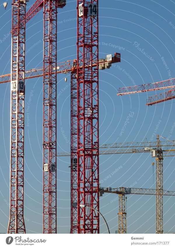 building mania Colour photo Exterior shot Day Sunlight Wide angle Forward Work and employment Craftsperson Construction worker Crane operator Construction site