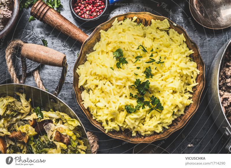 Yellow rice in old pot Food Vegetable Grain Herbs and spices Nutrition Lunch Organic produce Crockery Pot Pan Lifestyle Style Design Healthy Eating