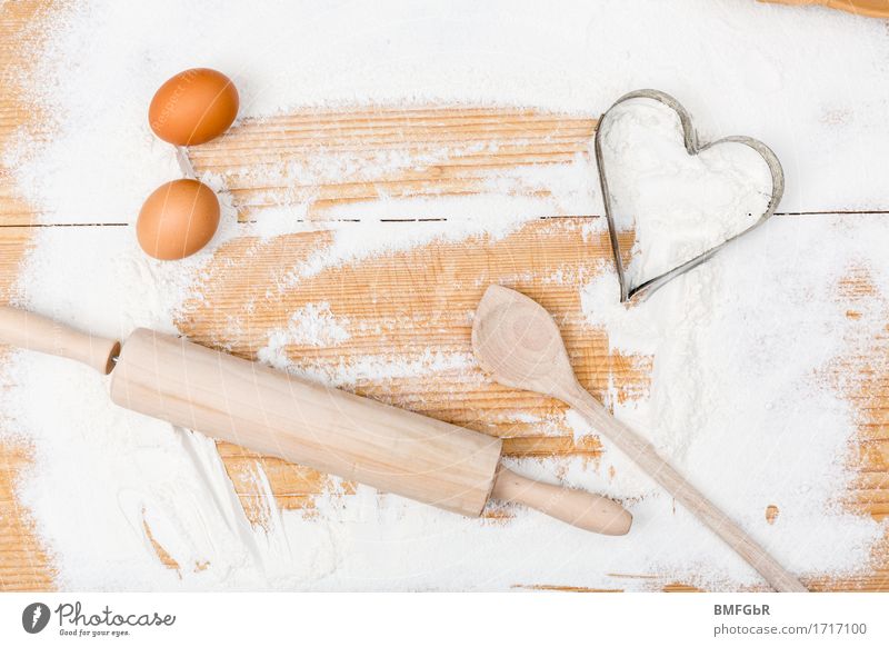 cooking course Flour Egg Wooden spoon corrugated wood corrugated board Chopping board Heart Ingredients Baking recipe Colour photo Multicoloured Studio shot
