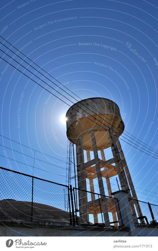 Always warm water Silhouette Back-light Wide angle Water Sky Sun Warmth Tower Architecture Old Gigantic Thirst Apocalyptic sentiment Fence Ladder Cistern