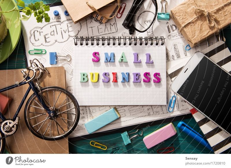 Small business concept - letters on the desk Lifestyle Design Desk Table Workplace Office Business SME Telephone Cellphone Screen Paper Wood Creativity