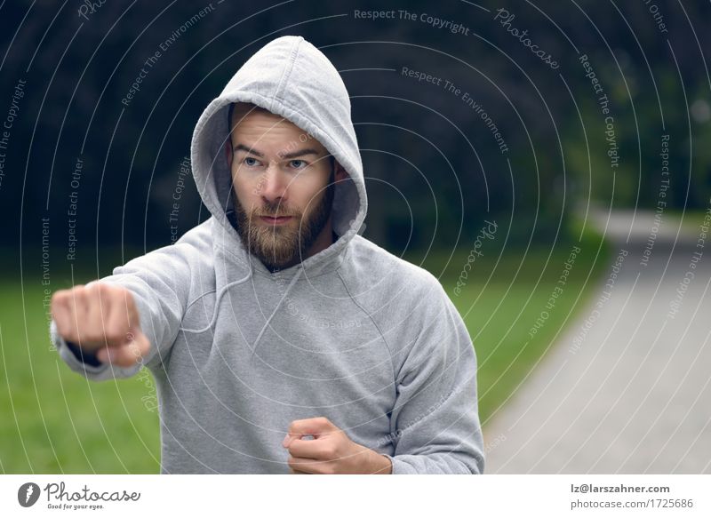 Young man working out in a park Lifestyle Sports Masculine Man Adults 1 Human being 18 - 30 years Youth (Young adults) Park Beard Fitness Action athlete