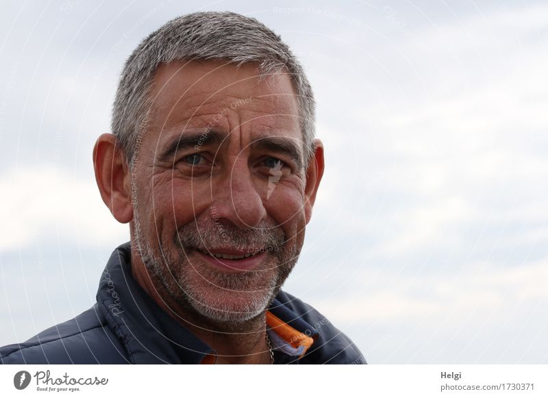 friendly senior with grey hair and grey beard smiles into the camera Human being Masculine Man Adults Male senior Senior citizen Head Hair and hairstyles Face