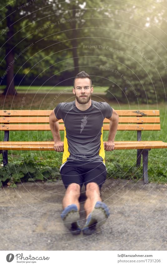 Young man exercising in a park Lifestyle Body Face Sports Man Adults 1 Human being 18 - 30 years Youth (Young adults) Nature Park Beard Wood Fitness Athletic