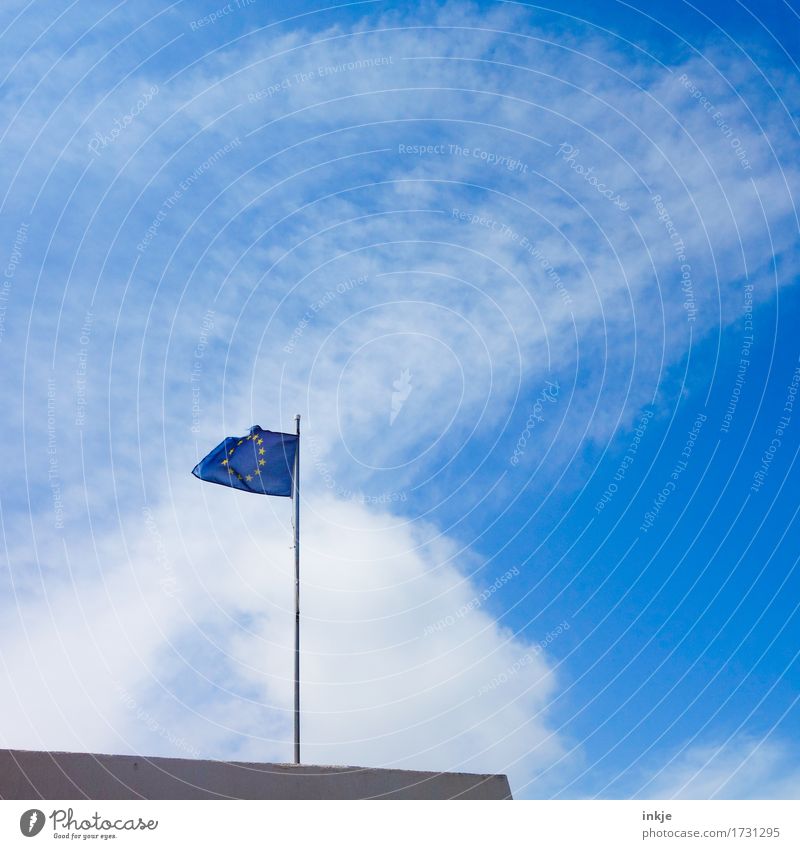 Hard on the wind Sky Summer Beautiful weather Wind Sign Network Flag European flag Europe emblem Blue Fear of the future Society Crisis Might Politics and state