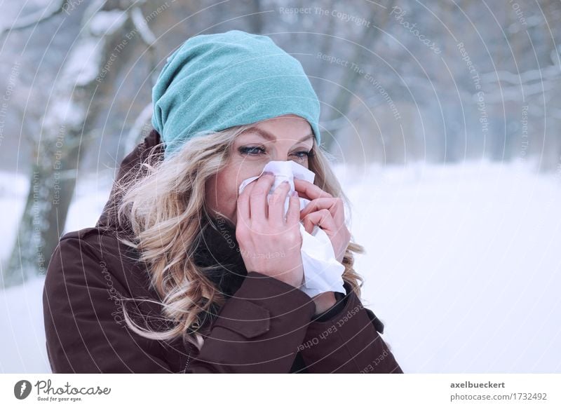 woman blowing her nose in winter Lifestyle Healthy Illness Winter Snow Human being Feminine Young woman Youth (Young adults) Woman Adults 1 30 - 45 years Nature