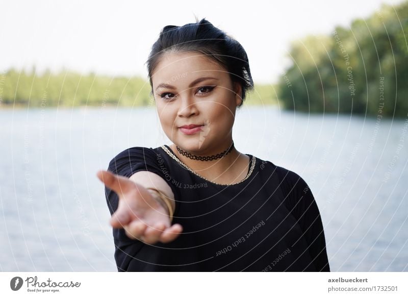 young asian woman reaching out Lifestyle Human being Feminine Young woman Youth (Young adults) Woman Adults 1 18 - 30 years Nature Lake Friendliness