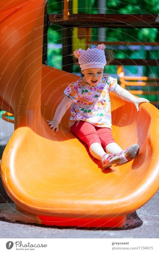 Small girl at the playground having fun on a slide Joy Playing Summer Sun Child Girl Infancy 1 Human being 1 - 3 years Toddler Playground Plastic Cute kid