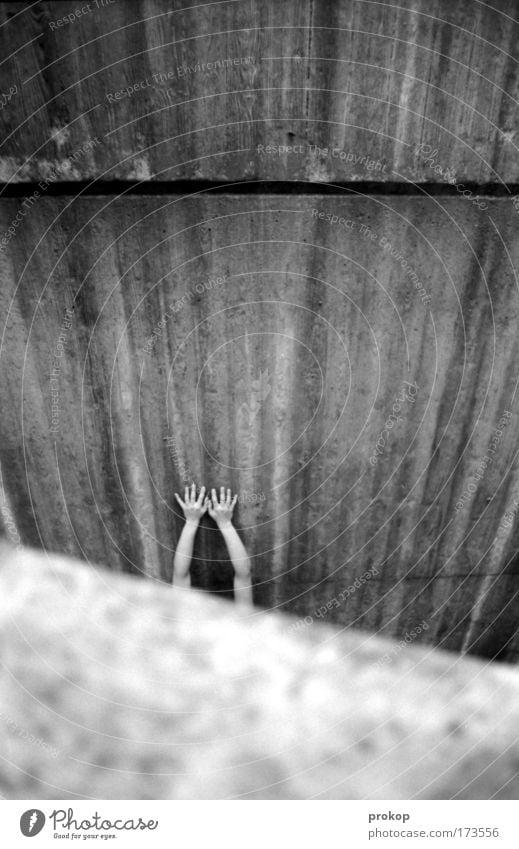 lost Black & white photo Exterior shot Day Feminine Arm Hand Fingers Fear Claustrophobia Fear of the future Dangerous Distress Perturbed Concrete Hard Cold