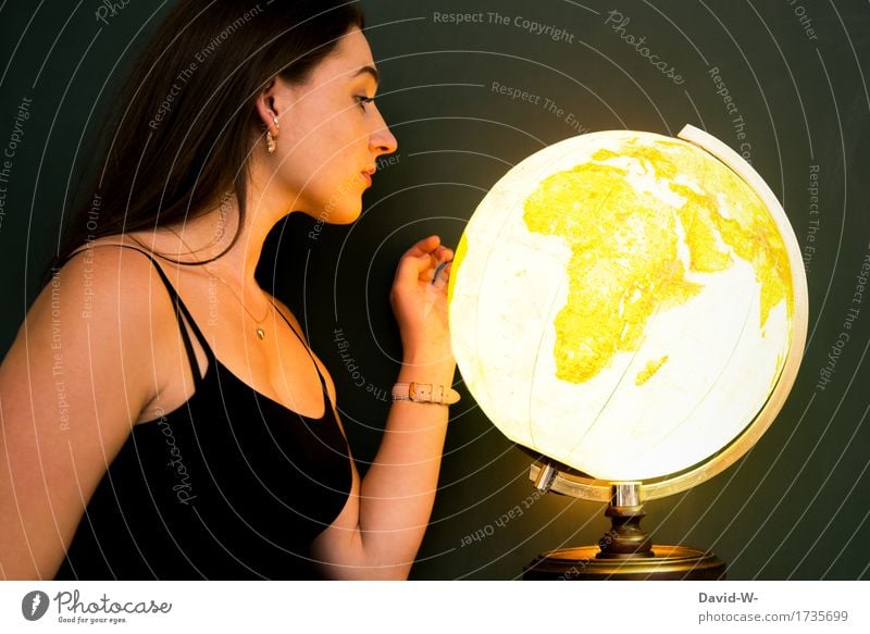 young woman with a shining globe Globe Global world Around-the-world trip contemplating look at luminescent Illuminate golden Young woman youthful pretty