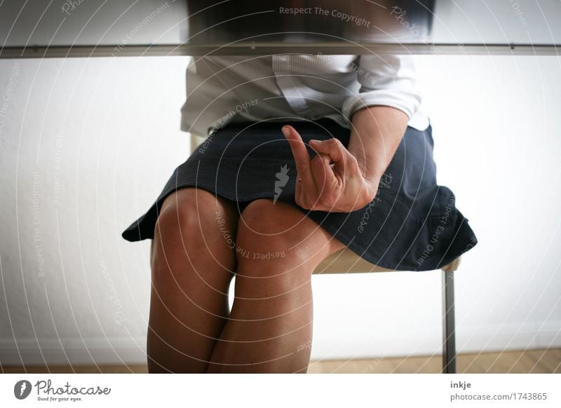 View under table, Woman showing middlefinger Style Adults Life Body Hand Fingers Middle finger 1 Human being 30 - 45 years Skirt Blouse Chair Table Communicate