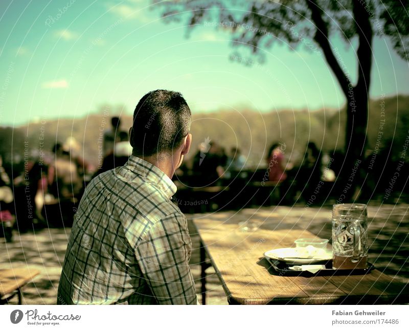 watching the last supper Colour photo Exterior shot Day Shallow depth of field Rear view Looking away Beer Crockery Leisure and hobbies Human being Masculine