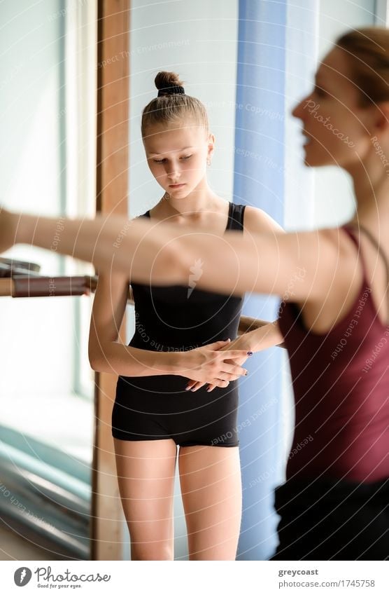 Candid of ballerina standing looking at the floor Dance School Teacher Academic studies Human being Girl Woman Adults 2 13 - 18 years Youth (Young adults)