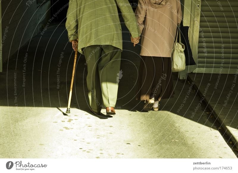 couple Couple Matrimony Relationship Romance Love Affection Together Hold hands Man Woman Old Senior citizen Retirement Tunnel Dark Passage Stick Walking aid