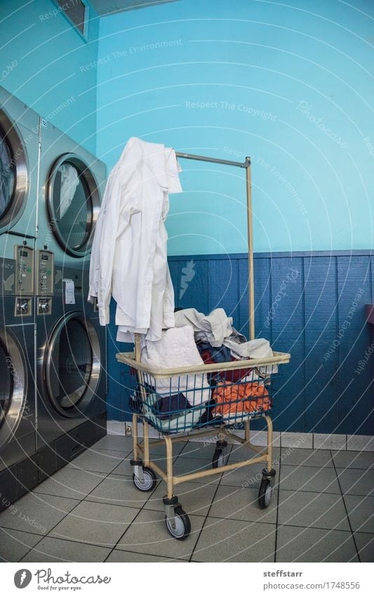 Washing clothes and drying at the Laundromat Machinery Industry Clothing T-shirt Shirt Skirt Pants Underwear Cleaning Blue Turquoise White Colour photo