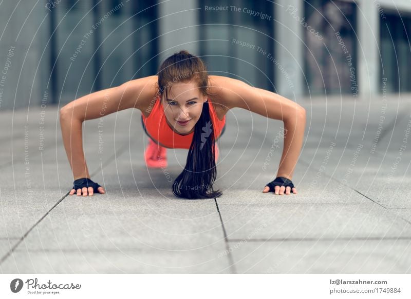 Fit young woman doing push-ups Lifestyle Face Summer Sports Woman Adults 1 Human being 18 - 30 years Youth (Young adults) Small Town Brunette Fitness Thin