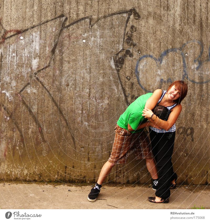 Ah - Good! A fight! Colour photo Exterior shot Copy Space left Copy Space top Full-length Looking into the camera Looking away Human being Masculine Young woman